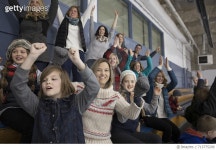 713775209 | 게티이미지코리아 | Mothers and children cheering in stadium bleachers at ice hockey game Royalty-Free 이미지