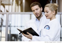 723504545 | 게티이미지코리아 | Two doctors looking at diary Royalty-Free 이미지