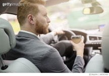 680303466 | 게티이미지코리아 | Young businessman drinking coffee to go in his car Royalty-Free 이미지