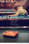 685849182 | 게티이미지코리아 | Young woman playing billiard in a pub and aiming at the ball. Royalty-Free 이미지