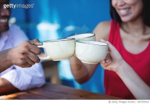 687359916 | 게티이미지코리아 | Friends making a toast with coffee at a cafe Royalty-Free 이미지