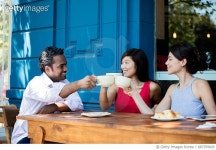 687359920 | 게티이미지코리아 | Friends making a toast with coffee at a cafe Royalty-Free 이미지