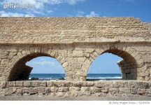 722309391 | 게티이미지코리아 | Ancient Roman Aqueduct At Caesarea Beach Against Sky Royalty-Free 이미지