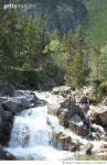 724330535 | 게티이미지코리아 | Scenic View Of Waterfall Along Trees Royalty-Free 이미지