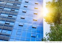 681722840 | 게티이미지코리아 | modern office building with green leaves on foreground Royalty-Free 이미지