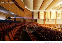 LS1703222 | 게티이미지코리아 | Projector glowing over empty seats in auditorium Rights-Managed 이미지