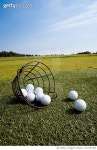 LS1703263 | 게티이미지코리아 | Basket of golf balls spilling onto grass Rights-Managed 이미지