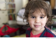 672514774 | 게티이미지코리아 | PC RM Hispanic, Mixed Race boy, 18-23 months, in living room of city apartment Rights-Managed... 