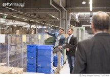723523809 | 게티이미지코리아 | Three businessmen in factory warehouse Royalty-Free 이미지
