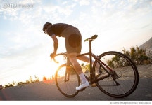 690329432 | 게티이미지코리아 | Male cyclist racing the sunrise Royalty-Free 이미지