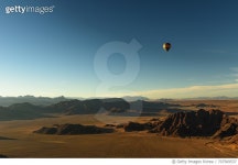 707569537 | 게티이미지코리아 | Hot Air Balloon Flying Over Desert Against Sky Royalty-Free 이미지