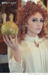 730190593 | 게티이미지코리아 | Portrait Of Young Woman Holding Golden Ball Royalty-Free 이미지