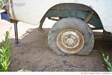 게티이미지코리아 | Africa, Central African Republic, View Of Punctured Tyre, A Daily Chore (Year 2000) Royalty-Free 이미지