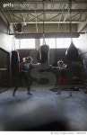 728760973 | 게티이미지코리아 | Mother and daughter boxers boxing at punching bag at gym Royalty-Free 이미지