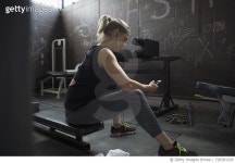 728761225 | 게티이미지코리아 | Woman weightlifting, resting and listening to music with headphones and mp3 player at gym Royalty... 