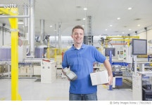 730133823 | 게티이미지코리아 | Engineer With Scanner In Solar Panel Manufacturing Plant Royalty-Free 이미지