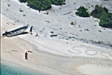 SOS in sand helps save stranded couple on uninhabited... Corporation) SOS in sand helps save stranded couple on uninhabited... 
