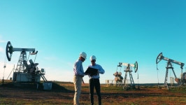 Two Engineers Inspecting Oil Field 스톡 동영상 비디오(100% 로열티 프리) 1061416006 | Shutterstock
