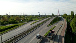scenic beauty of an asphalt road on a sunny day as cars pass by from a drones perspective car drive on the asphalt aerial drone... 