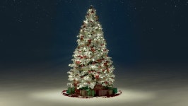 New Years mood - Christmas tree blinking with different lights at night during snowfall in the midst of the lanterns around... 