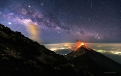 APOD: 2019 May 27 - A Volcano of Fire under a Milky Way of Stars
