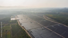Footage B Roll of Aerial view drone Hyperlapse Timelapse Solar cell farm at sunrise morning. Solar power plants have foggy moving... 