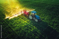 Aerial view of farming tractor plowing and spraying on field Stock Photo | Adobe Stock Aerial view of farming tractor plowing and... 