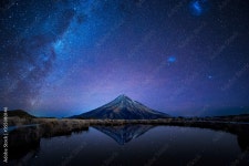 Night sky over Mt. Taranaki reflecting in Pouakai Pool, New Zealand Stock Photo | Adobe Stock Night sky over Mt. Taranaki... 