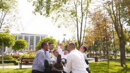 Slow motion. Stock 비디오 | Adobe Stock Groomsmen toss groom in the air. Man flexing and having fun with best friends on... 