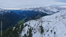 Aerial footage flying past the slopes of a snow covered mountain that has trees. Stock Video | Adobe Stock Aerial footage flying... 