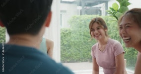 Stockvideo Group of young adult gen z asia people mindful floor sitting circle yoga zen class stress relief talk self love at gym... 