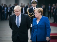 Johnson Lays on Royal Welcome for Merkel on Her Final U.K. Visit - Bloomberg Johnson Lays on Royal Welcome for Merkel on Her... 