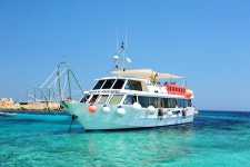 Olbia: Maddalena Archipelago Boat Tour with Minibus Transfer | GetYourGuide
