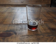 British ale beer pint. A pint of british ale beer on a wooden pub table. | CanStock