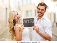 Summer holidays, wedding, dating and technology concept - couple with tablet pc in the city. | CanStock