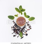Top view of healthy herbal tea in cup and mint leaves on grey. | CanStock