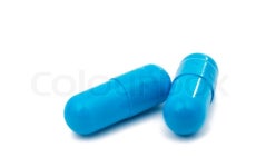 Blue capsules on white background | Stock image | Colourbox