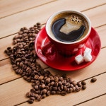 Red coffee cup on wooden table | Stock image | Colourbox
