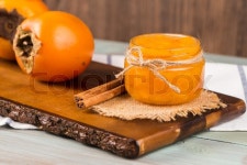 Delicious orange persimmons on wooden ... | Stock image | Colourbox