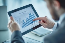 Human hand pointing at financial chart ... | Stock image | Colourbox