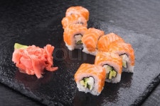 Sushi roll with tuna on wet stone board | Stock image | Colourbox