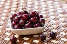 Fresh natural cherries in a white bowl ... | Stock image | Colourbox