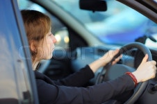 Portrait of young woman sitting in a ... | Stock image | Colourbox