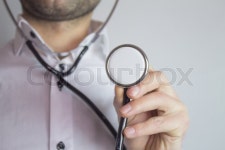 Businessman with stethoscope | Stock image | Colourbox