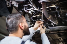Mature man mechanic repairing a car in ... | Stock image | Colourbox