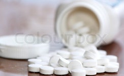 White pills near a jar | Stock image | Colourbox