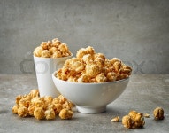 Bowl and glass of caramel popcorn on ... | Stock image | Colourbox