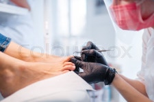 Cosmetologist salon, pedicure, polish ... | Stock image | Colourbox