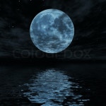 Big blue moon reflected in water ... | Stock image | Colourbox