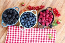 Three bowls of fresh berries on wooden ... | Stock image | Colourbox